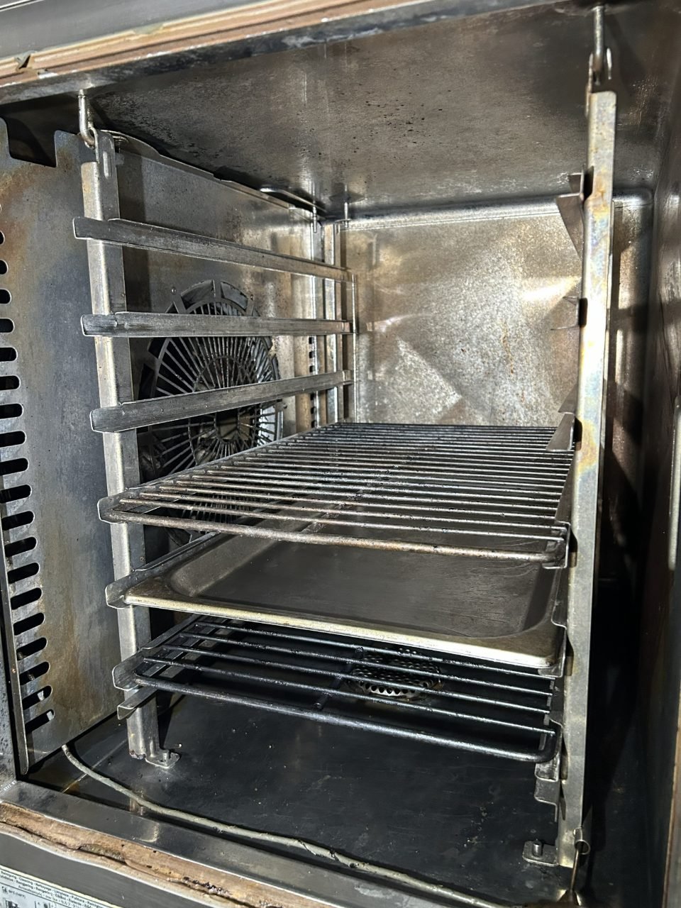 Baked-on residue inside an industrial oven